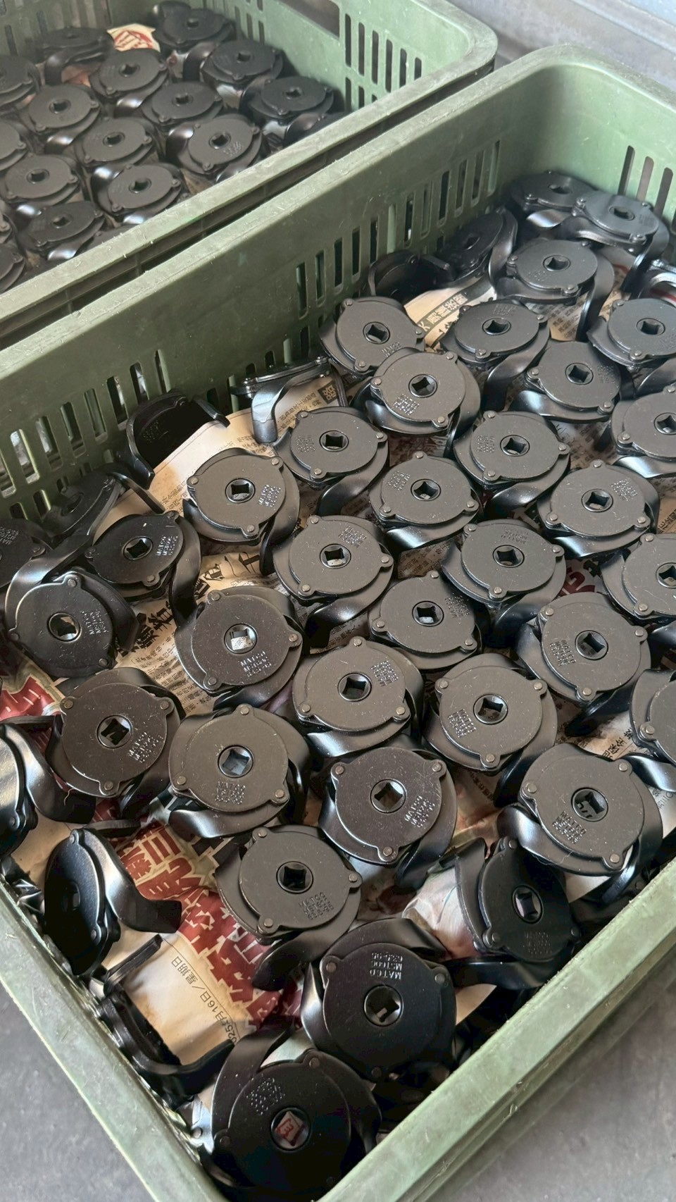 Batch of YFC cup-style filter tools in factory bins